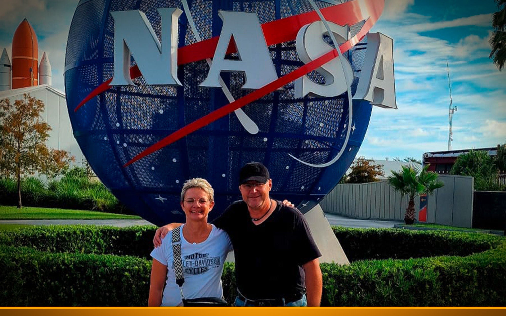 Couple in front of Nasa stature