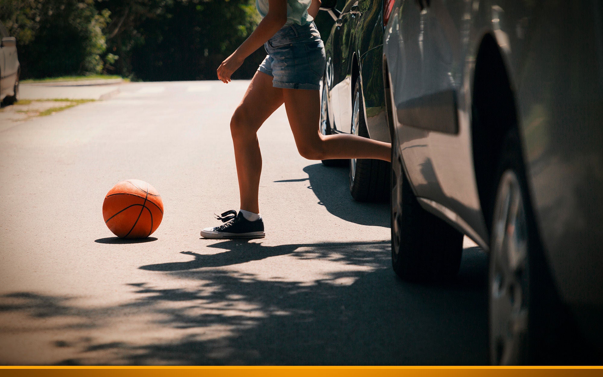 Girl runs after ball on the street