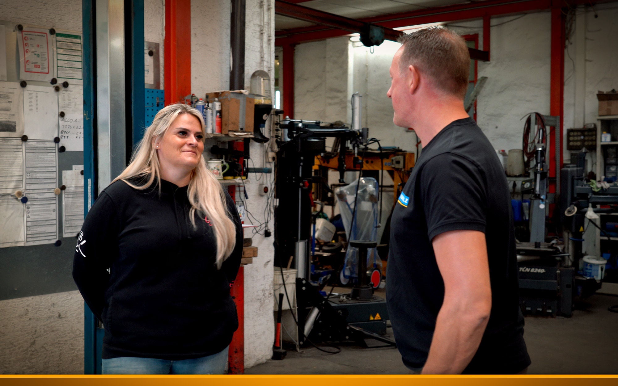 trucker chatting in a truck repair shop