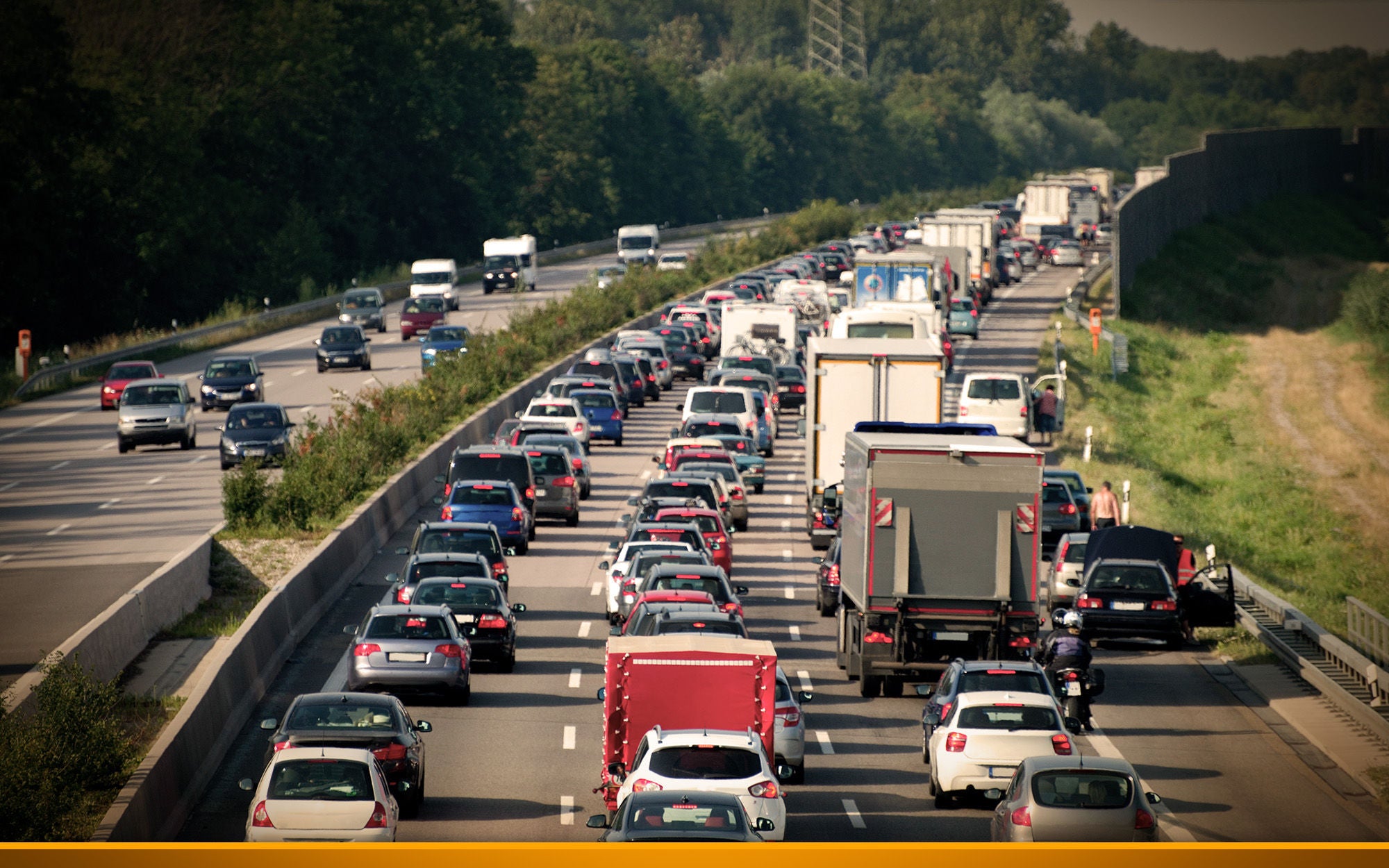 cars and trucks stuck in a traffic jam