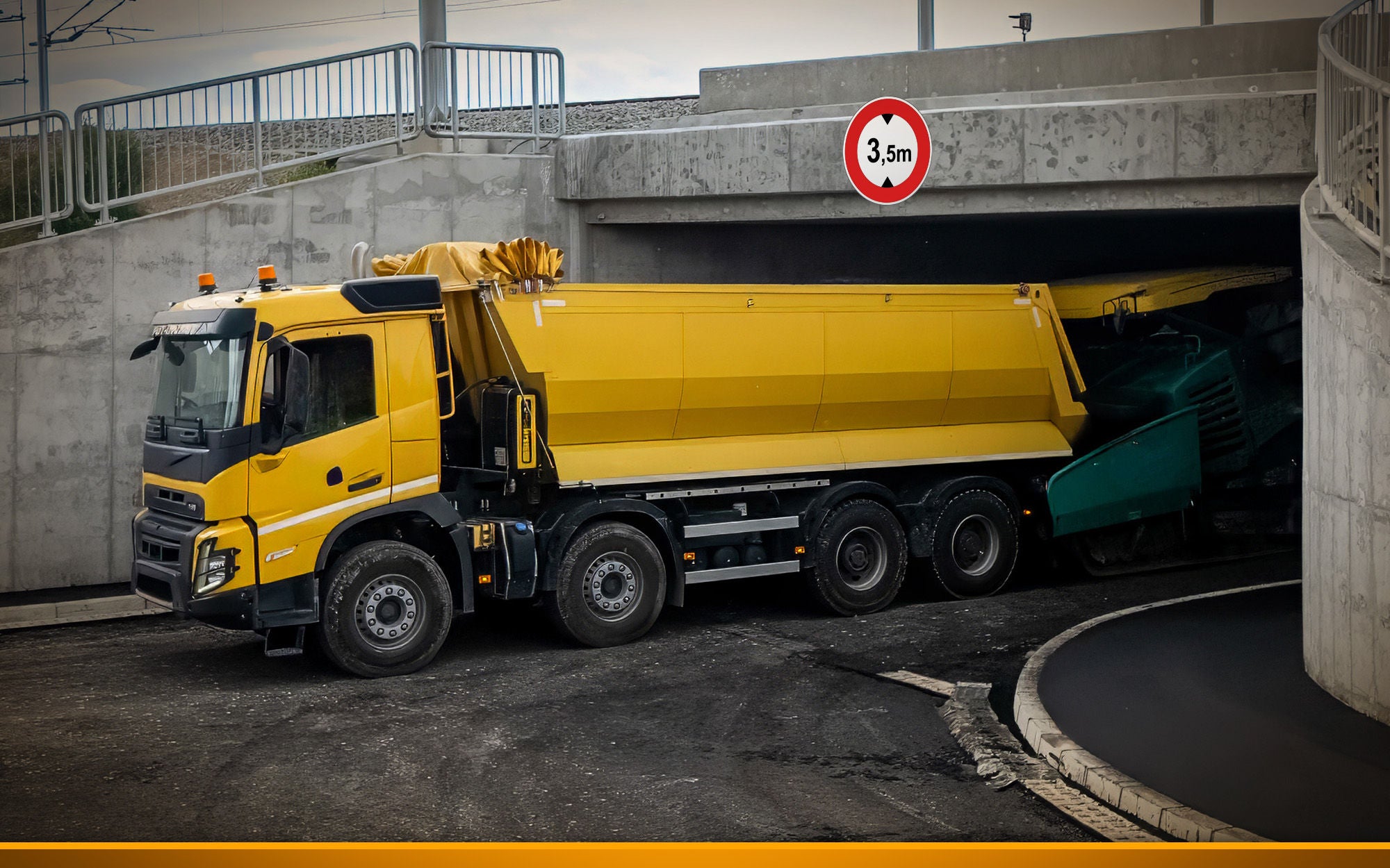 Truck under low bridge